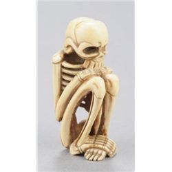 An ivory netsuke of a skeleton.