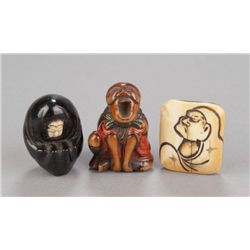 A group of three Daruma netsuke.