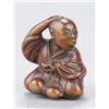 Image 1 : A wood netsuke of a mendicant.