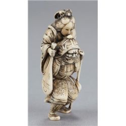 An ivory netsuke of Bishamon carrying Benten.