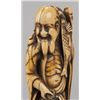 Image 2 : An ivory netsuke of a Sennin.