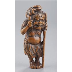 A boxwood netsuke of a Gama Sennin.