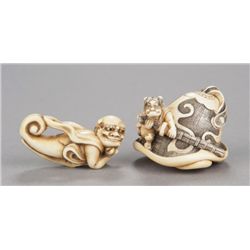 A group of two ivory netsuke of oni.