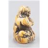 Image 10 : A group of three ivory netsuke.