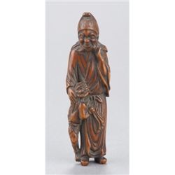 A wood netsuke of a Mongolian man.