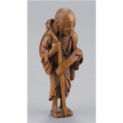 A wood netsuke of Ono no Komachi.