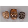 Image 1 : A group of three wood mask netsuke.
