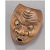 Image 4 : A group of three wood mask netsuke.