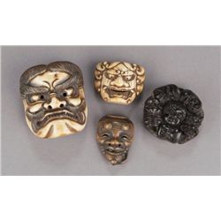 A group of four mask netsuke.