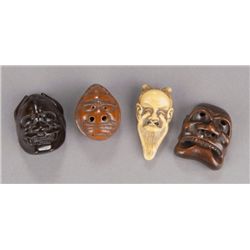 A group of four mask netsuke.