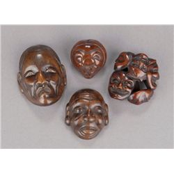 A group of four mask netsuke.