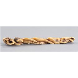 An ivory sashi netsuke of an awabi diver.
