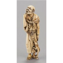 An ivory netsuke of a man.