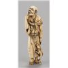 Image 1 : An ivory netsuke of a man.