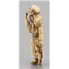 Image 3 : An ivory netsuke of a man.