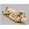 Image 6 : An ivory netsuke of a man.