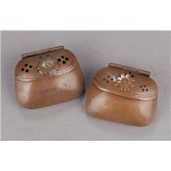 A pair of copper netsuke of ink pad pouches.