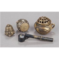 A group of four metal netsuke.