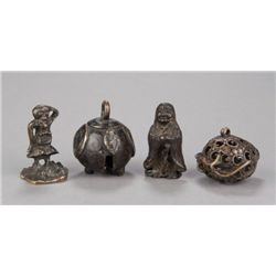 A group of four\four bronze netsuke.