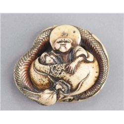 A stag horn netsuke of a Chinnan.