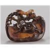 Image 1 : A tortoise-shell netsuke of a horse and spiderweb.