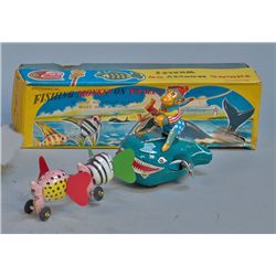 Mechanical Fishing Monkey On Whales
