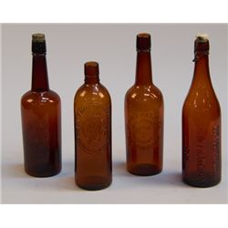 Lot of 4 Embossed Brown Glass Liquor Bottles: