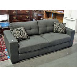 Grey contemporary living room sofa with 2 throw