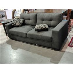 Grey contemporary living room sofa with 2 throw