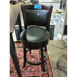 One black leather seated swivel bar stool