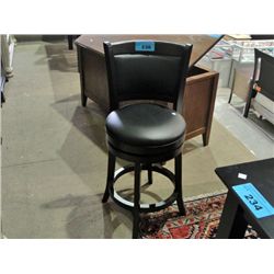 One black leather cushioned swivel bar stool