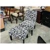 Image 1 : Zebra patterned accent chair with matching foot