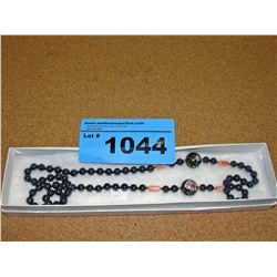 Polished metal beads and oriental cloisenay