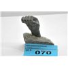 Image 1 : Inuit soapstone carved fist on rock