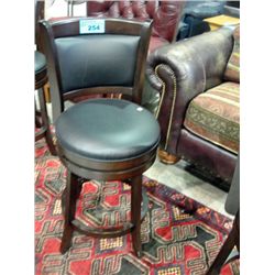 Black leather padded swivel bar stool
