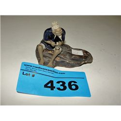 Oriental mud man figurine