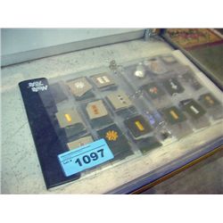 Album filled with assorted military sew on badges