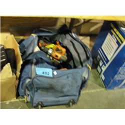 Large work duffel bag filled with assorted cordle