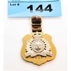 Royal mounted police brass badge with leather