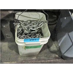 White pail full of heavy chain link