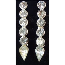 Two vintage matching rhinestone pins. Foil back rhinestones glued into pot metal