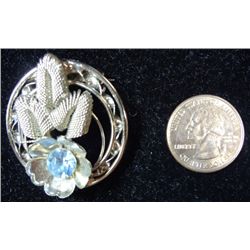 Vintage Silver tone Costume Jewelry Brooch. Blue rhinestone  stylized flower.