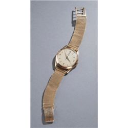 Omega 18K gold man's wrist watch.