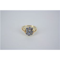 Tanzanite oval cluster ring in 10KT yellow gold.