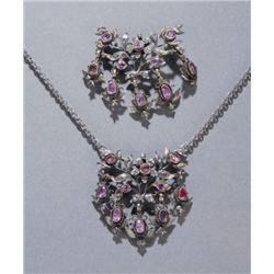 Group of 2 gold floral ruby & diamond pendants.
