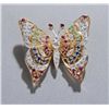 Image 1 : 18KT gold butterfly brooch set with gems.