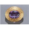 Image 1 : Oval 14K gold brooch with bezel-set amethyst.
