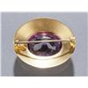 Image 2 : Oval 14K gold brooch with bezel-set amethyst.