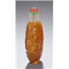 Image 2 : An amber glass overlay on snowflake snuff bottle.