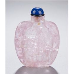 A tourmaline snuff bottle, carved sage on donkey.